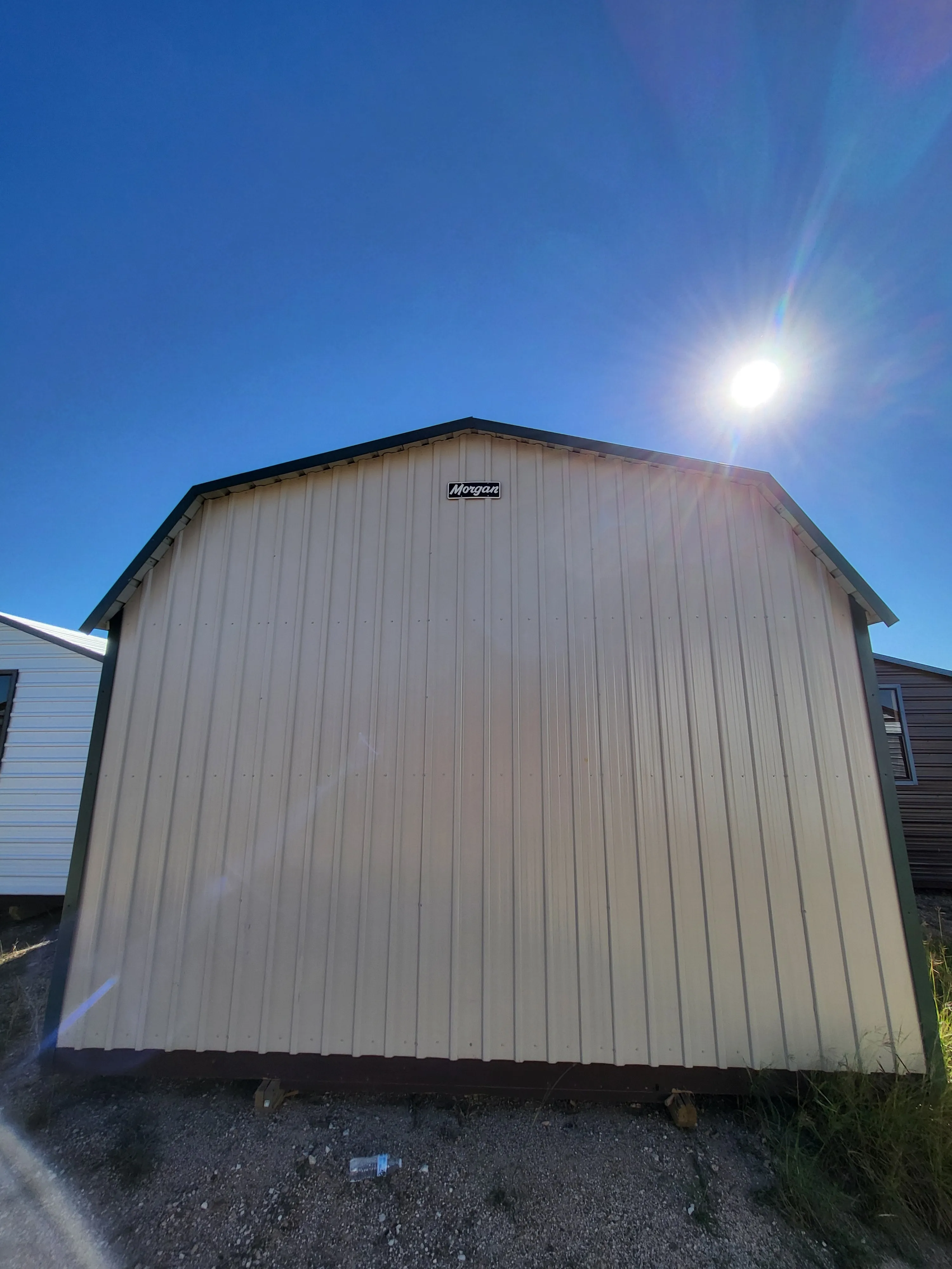 06 x 06 Steel Storage Shed in Tan Siding and Green Trim