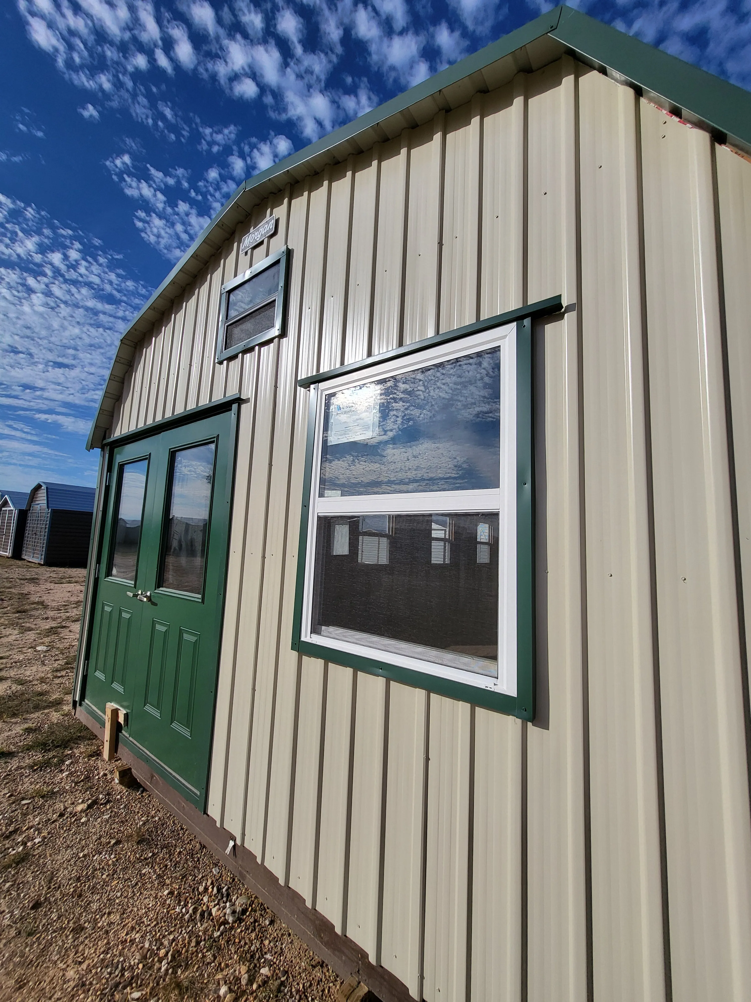 06 x 06 Steel Storage Shed in Tan Siding and Green Trim