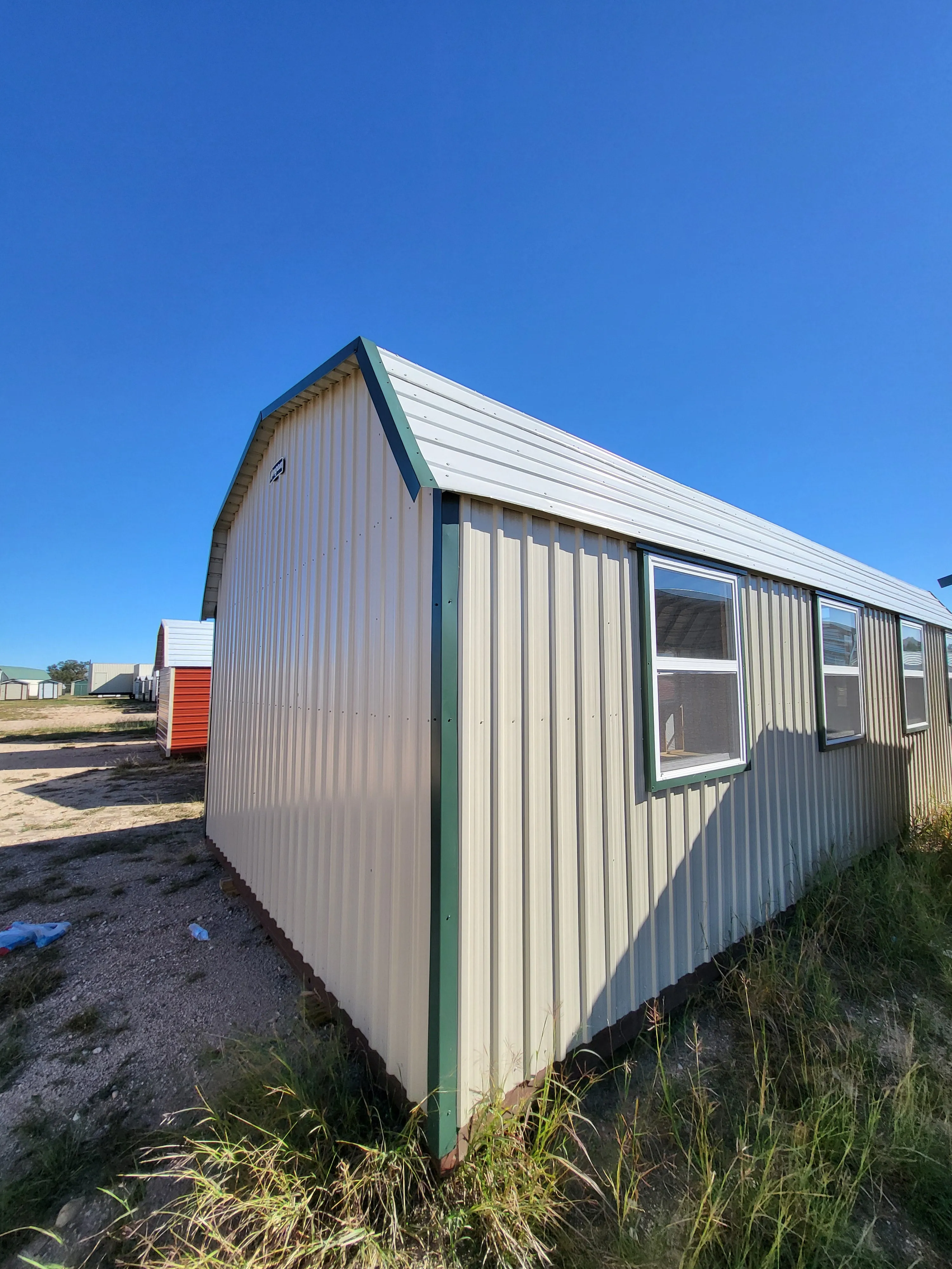 06 x 06 Steel Storage Shed in Tan Siding and Green Trim