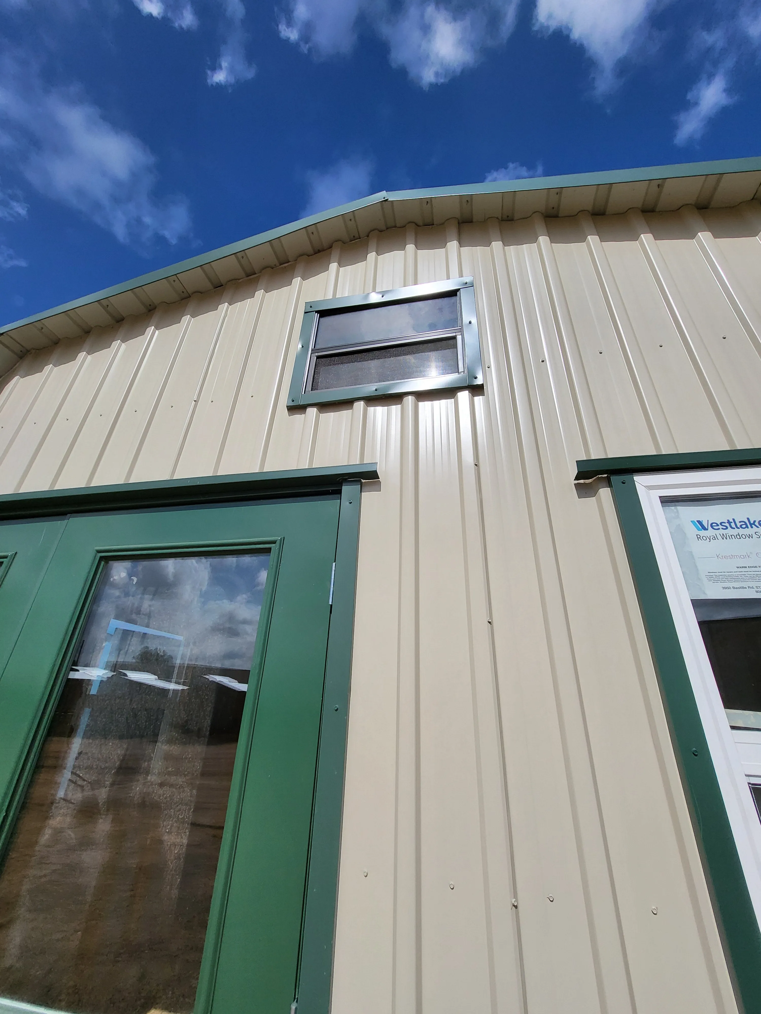 06 x 06 Steel Storage Shed in Tan Siding and Green Trim