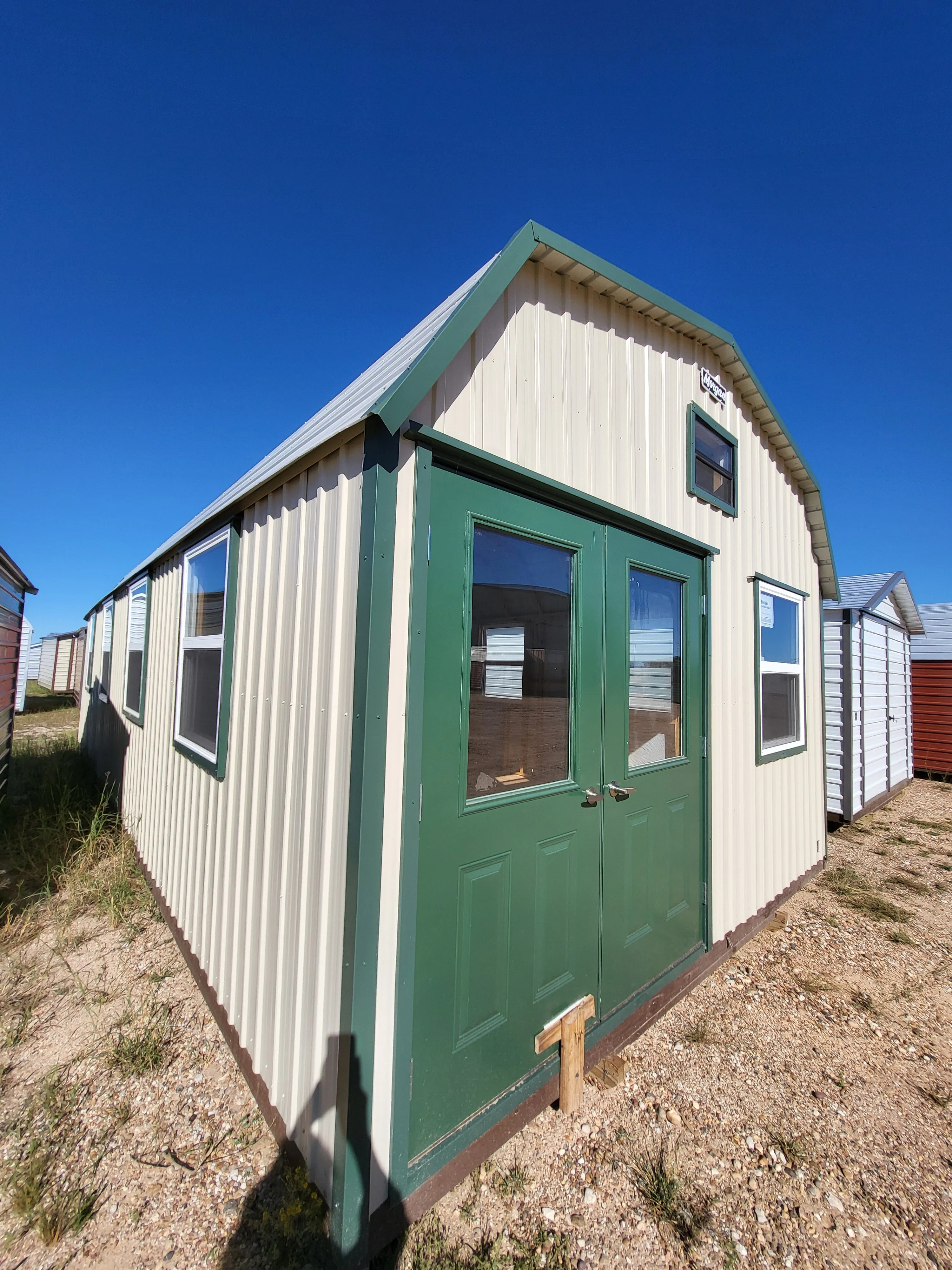 06 x 06 Steel Storage Shed in Tan Siding and Green Trim