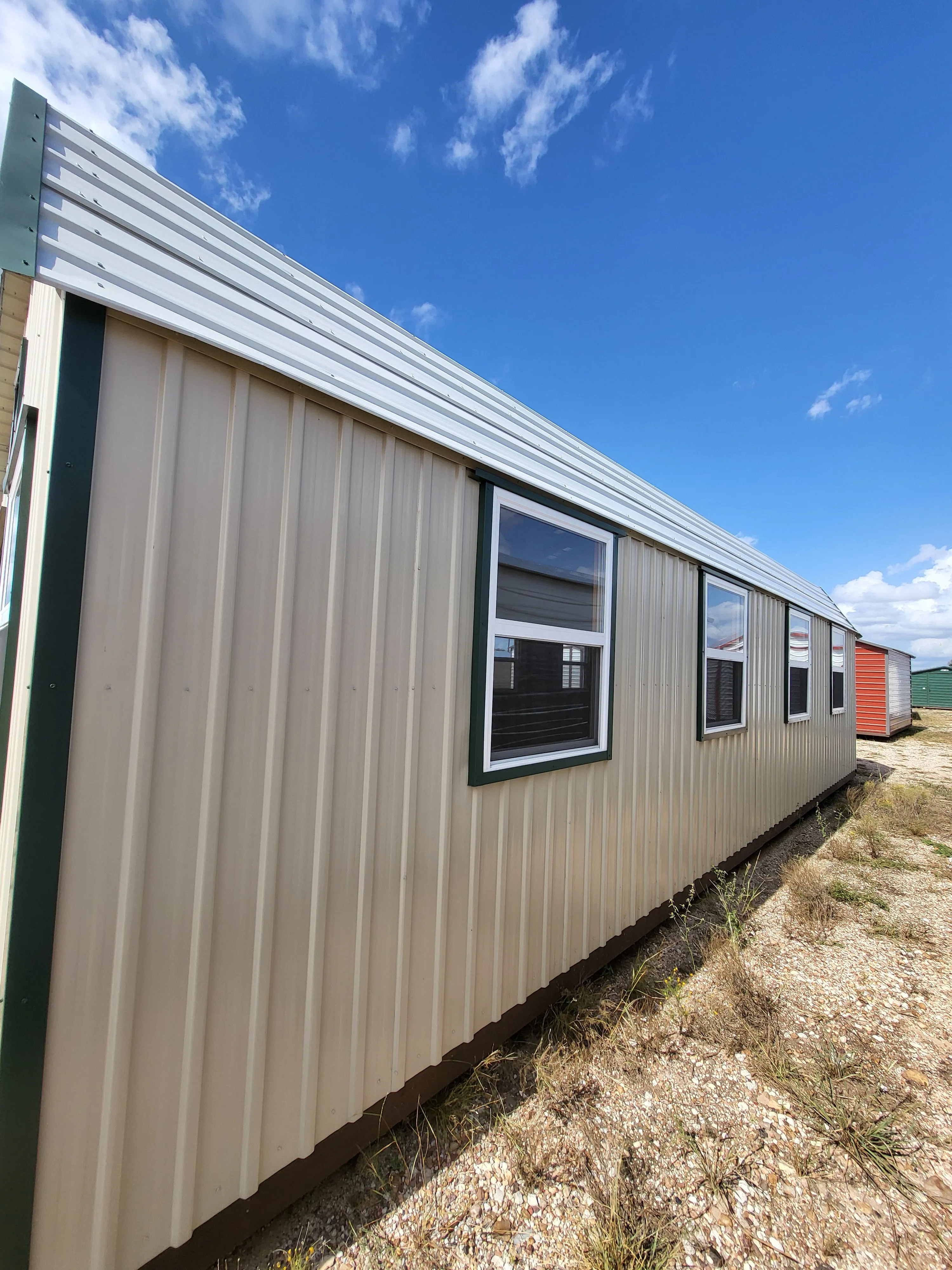 06 x 06 Steel Storage Shed in Tan Siding and Green Trim